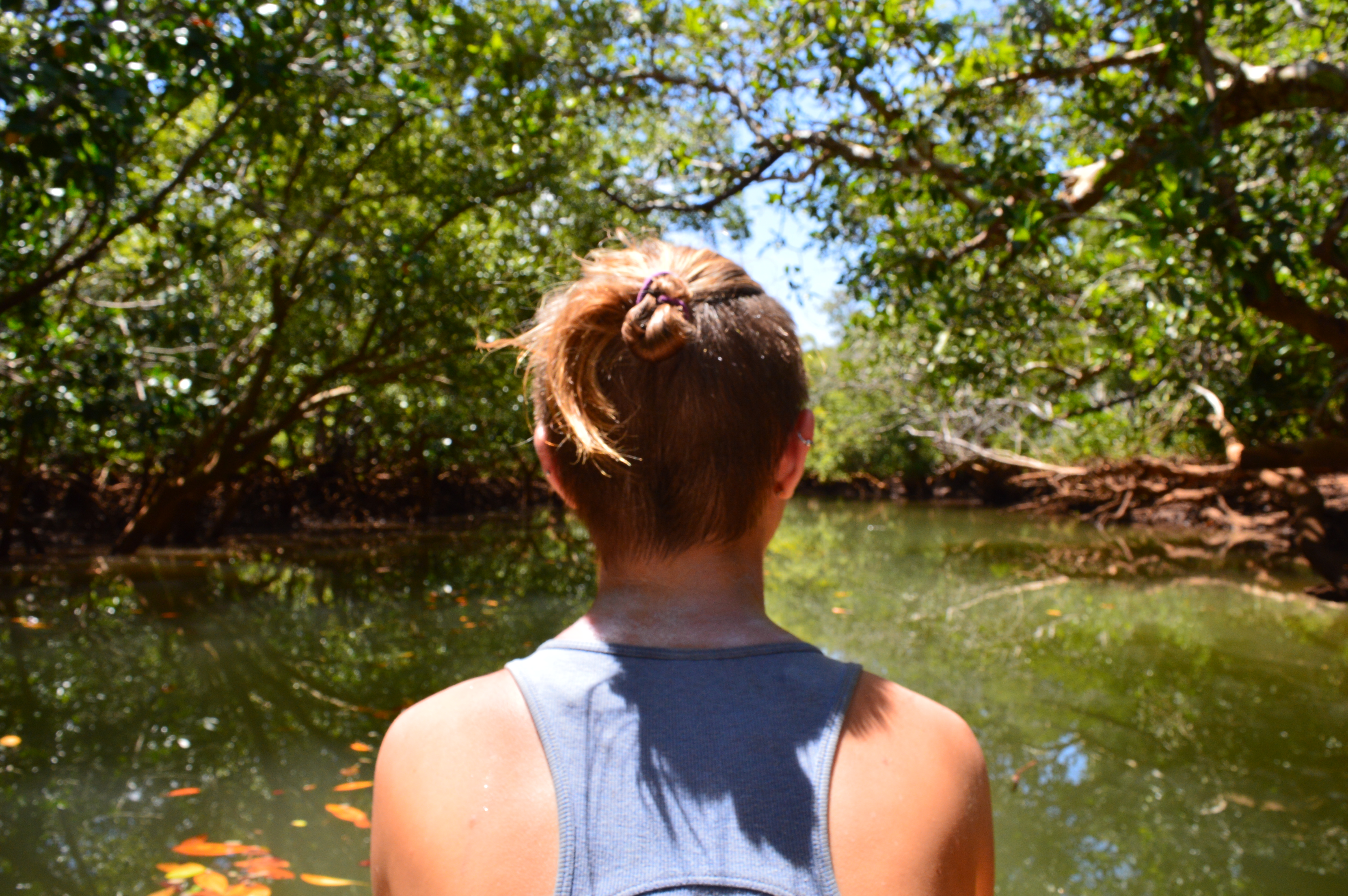Portrait while kayaking on a river in a mangrove. Mayotte (2015).
